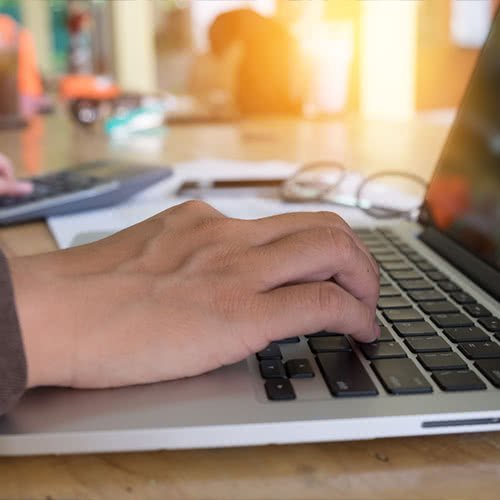 hand using laptop keyboard